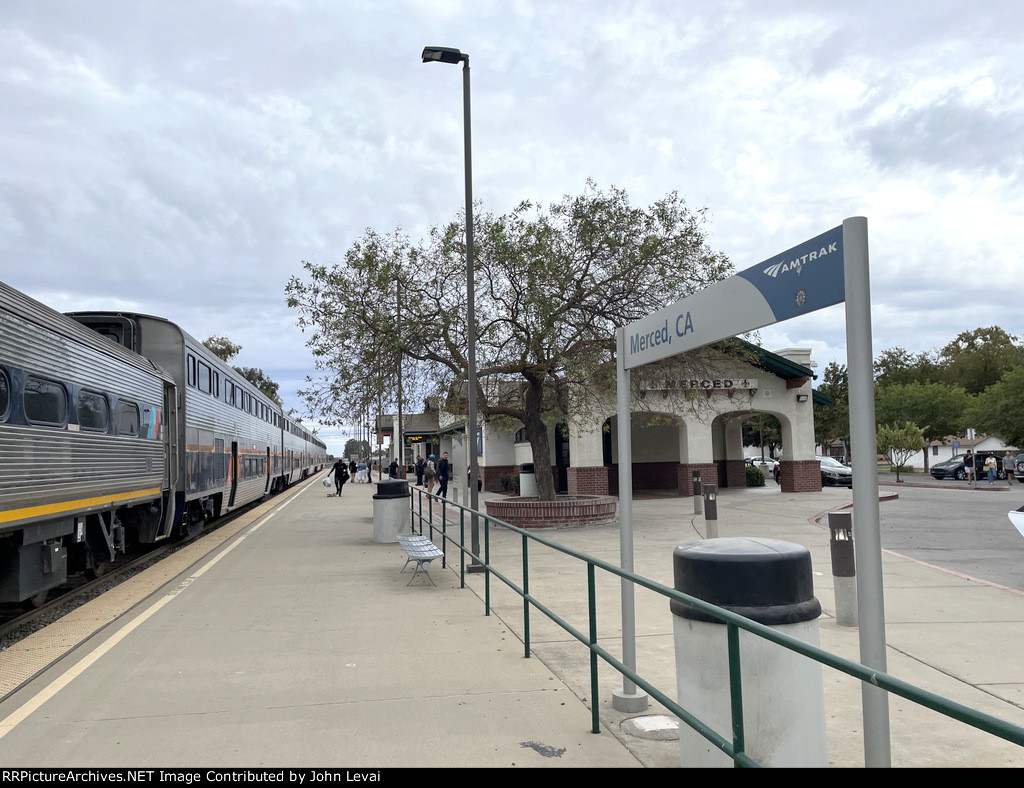 People enjoying fresh air on the platform at Merced Station